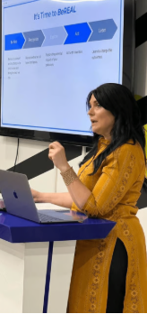 Team member presenting at a screen