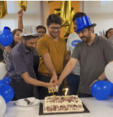 Team celebrating with a cake