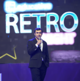 Speaker on stage at a retro event